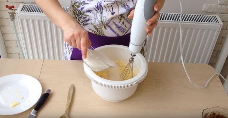 Add one egg and a piece of sugar to the butter, whisk.