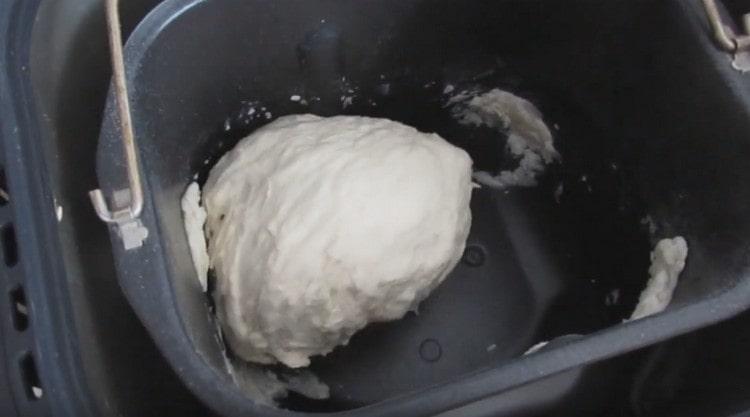In a bread maker, the dough is kneaded, then it settles and will bake.
