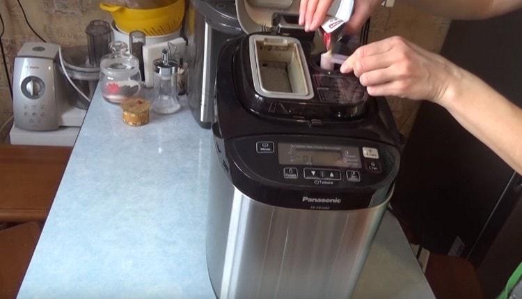 Pour dry yeast into a special compartment.