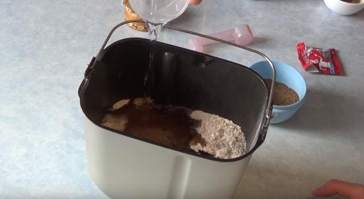 Add water to the components in the bucket.