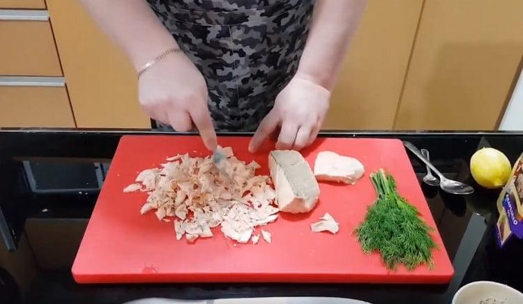 Boiled salmon slightly knead with a fork.