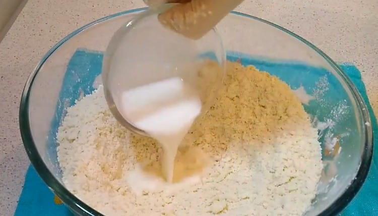 Pour milk into the dough.