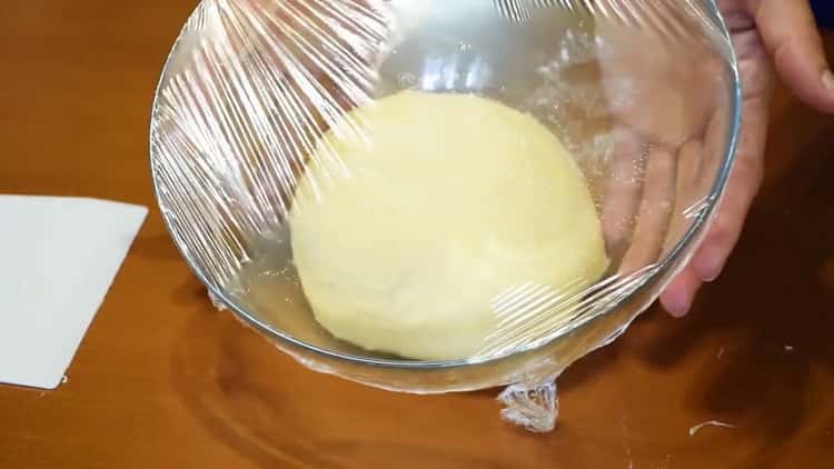 Knead the dough to make yeast bagels