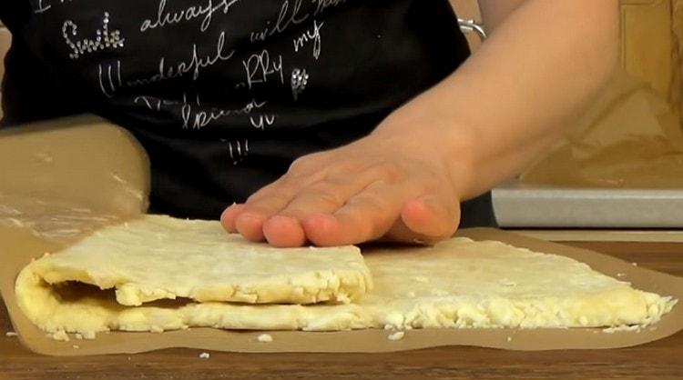 Fold the dough three times, then roll it out again.