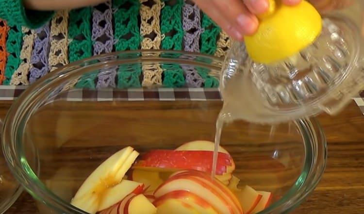 Pour apples with lemon juice.