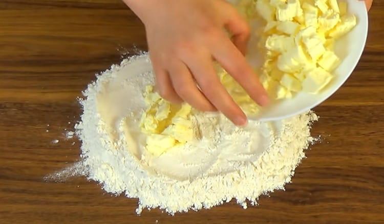 Pour the butter into the flour.