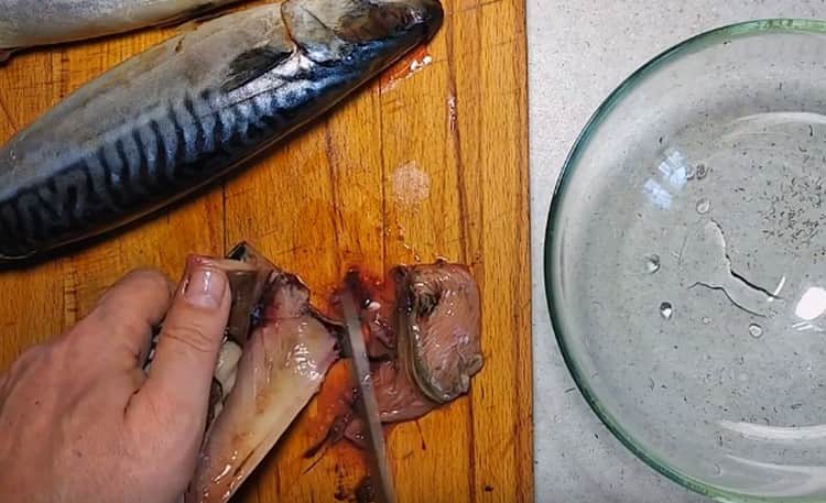 While the marinade is infused, clean and gut the mackerel.