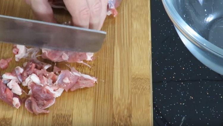 Finely chop the meat for the filling.