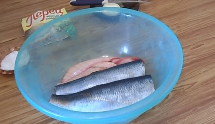 After gutting the fish, remove the black film inside.