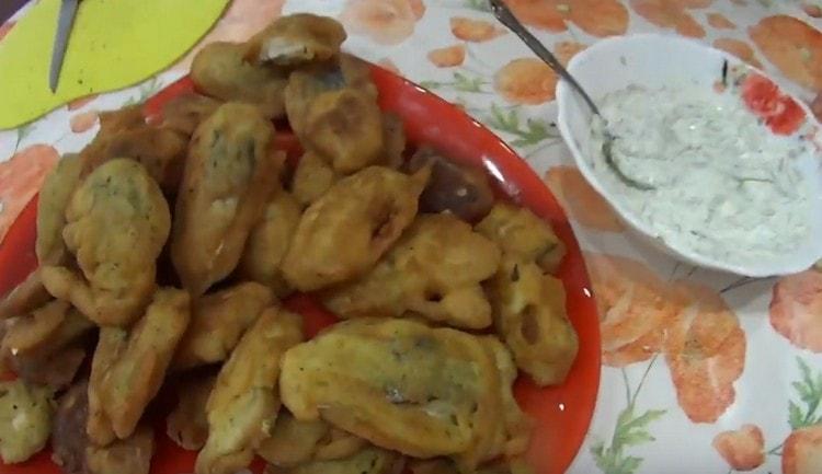 Mackerel in batter goes well with sour cream sauce.