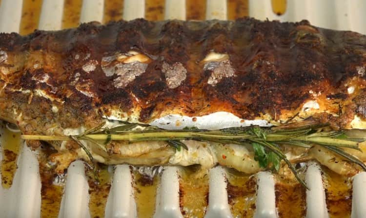 Cooking grilled mackerel.