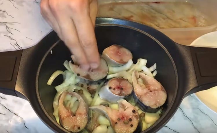 Again, repeat the layers of onion and fish.