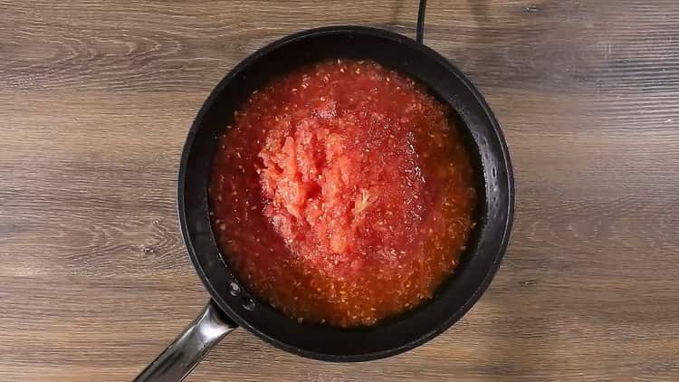 To cook spaghetti with tomato paste, heat the pan