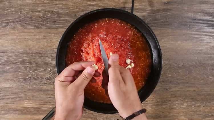 To make spaghetti with tomato paste, prepare the garlic
