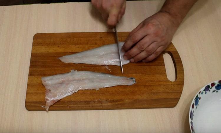 Pike perch cleaned, gutted, cut into fillets, and then into small pieces.