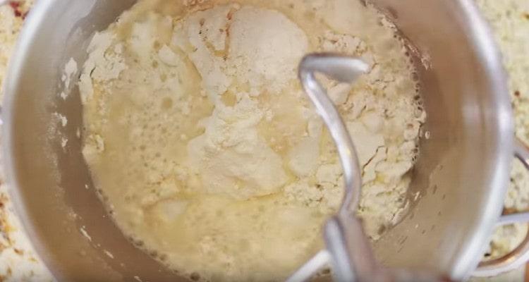 All the ingredients for the preparation of the dough are laid out in the mixer bowl.