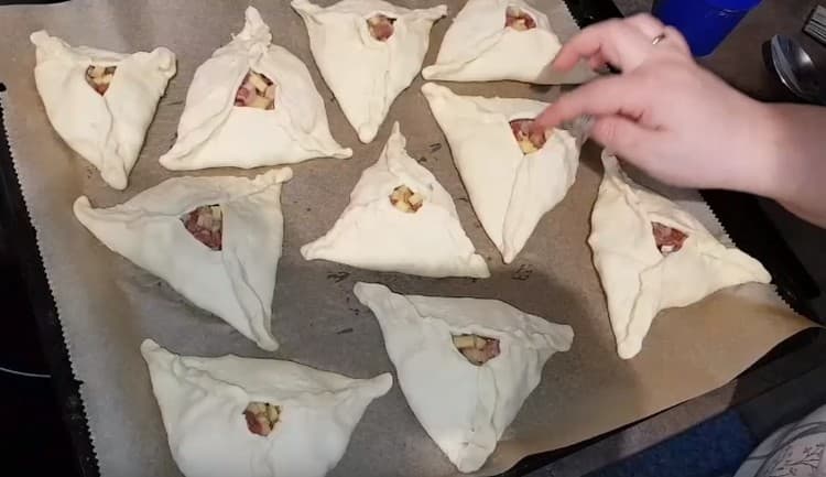 Put the pies on a baking sheet populated with parchment paper.