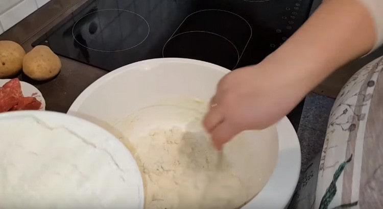 Add flour and mix the dough.