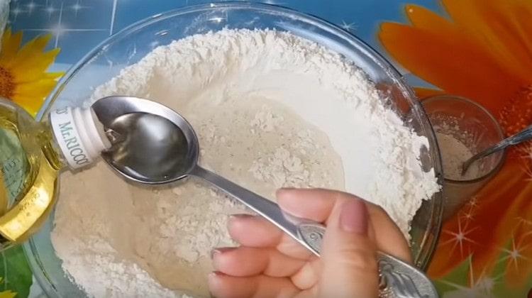 Add yeast to flour, add salt, sugar, vegetable oil.