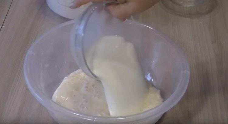 Add warm water and milk to the dough.