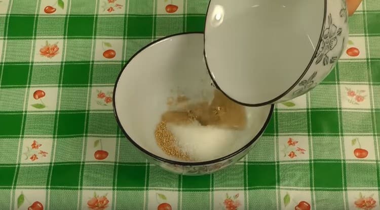We combine yeast with sugar and warm water.