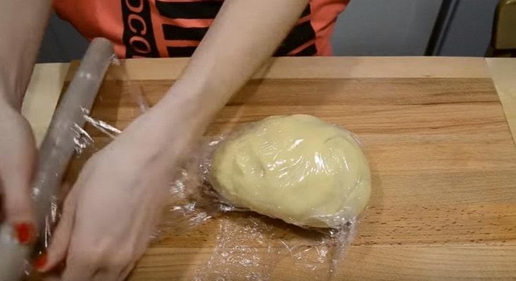 Put the dough in cling film.