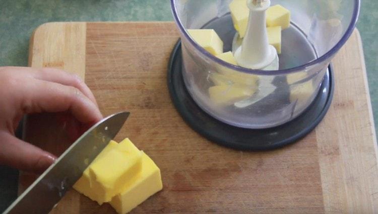 Put slices of cold butter in a blender bowl.