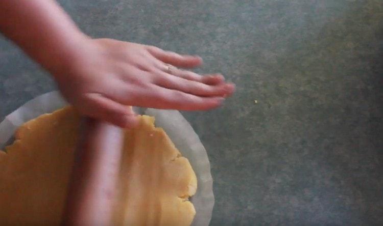 Then the dough can be rolled immediately on parchment, cut to fit the shape.