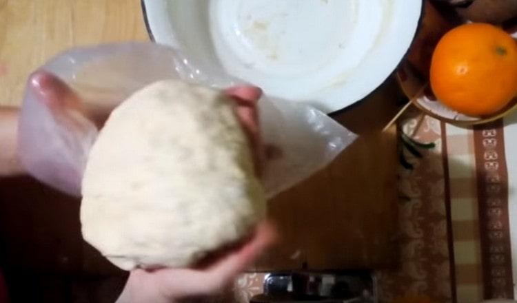 Place a ball of dough in a greased plastic bag inside.