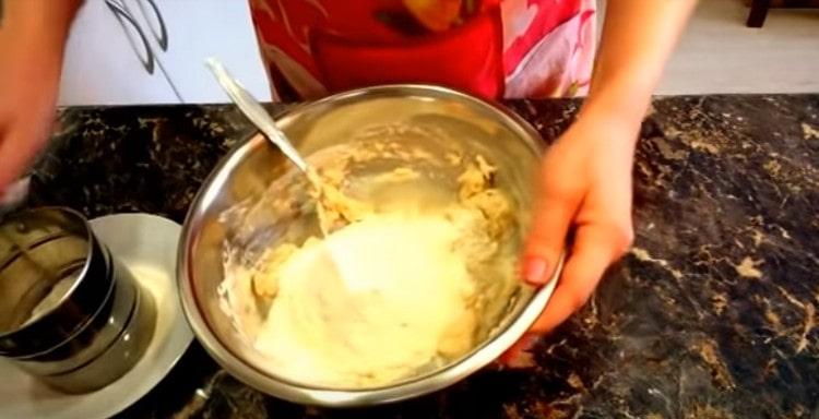Add a little more flour, kneading the dough.