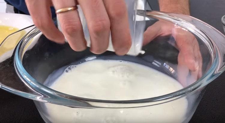 Pour warm milk into a bowl.