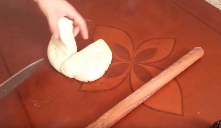 Cut the dough in half.