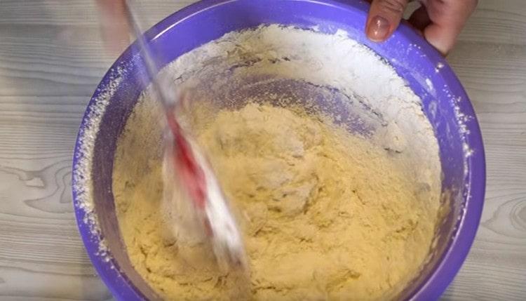 Mix the dough with a spatula.