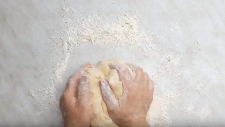 First, knead the dough with a spatula or a whisk, and then with your hands.