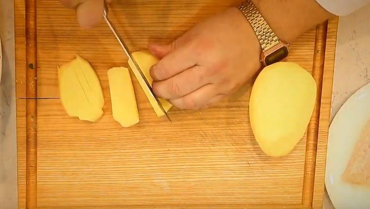 Cut potatoes for cooking fries.