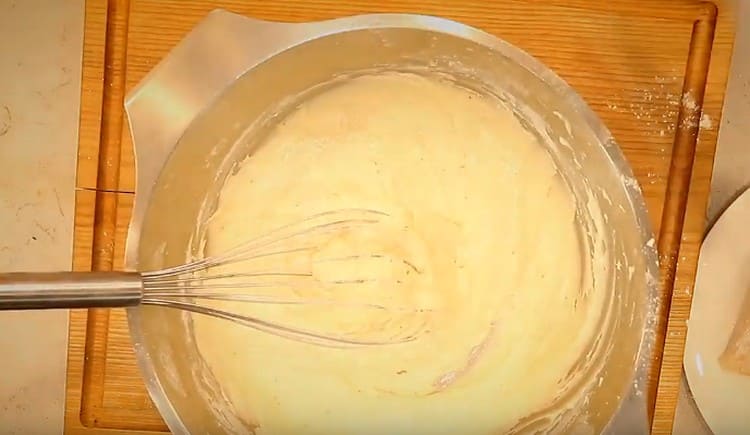 we introduce flour to the liquid components and mix the batter.