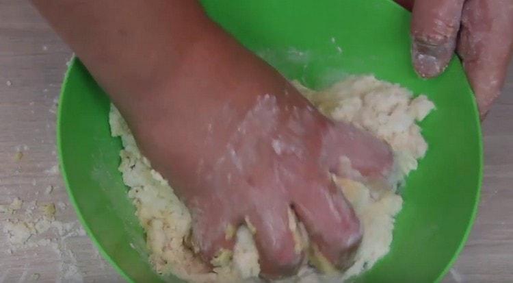 Add butter to flour and grind it all into crumbs.
