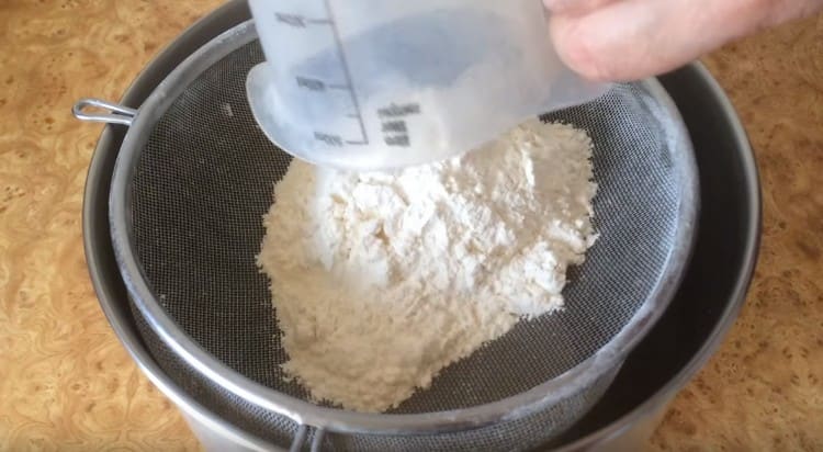 Pour the dough into the mixer bowl and sift the flour there.