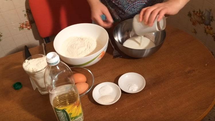 Pour kefir into a bowl for kneading dough.