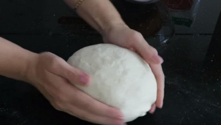 We collect the dough into a ball.