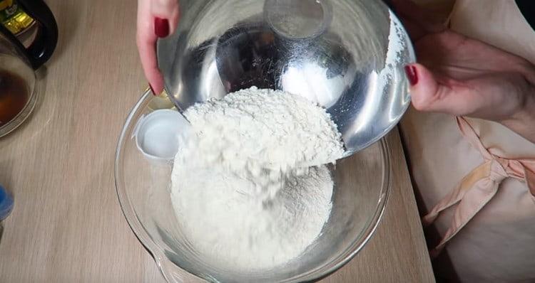 Pour flour into a large bowl.