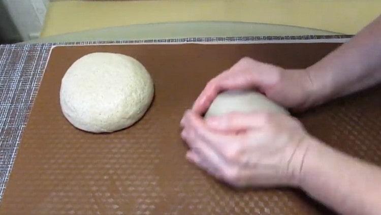 Divide the dough in half and round each part.