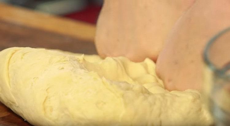 We knead the dough with hands.