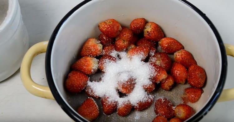 Cook strawberries with sugar and water.
