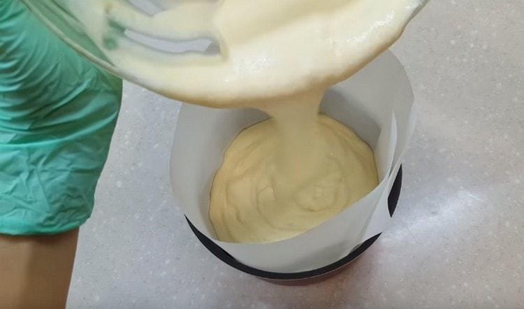 Pour the dough into a covered parchment form.