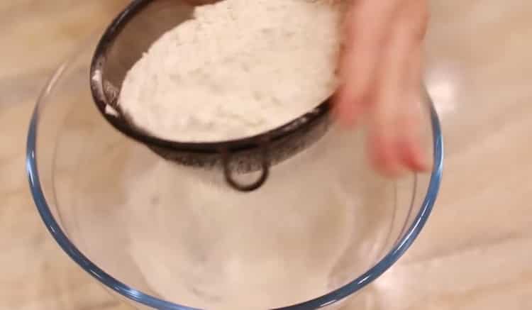 To make an orange cake, sift the flour