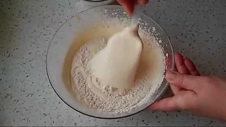 Sift flour to make biscuit muffins