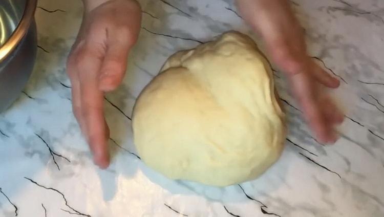 To make buns with boiled condensed milk, knead the dough
