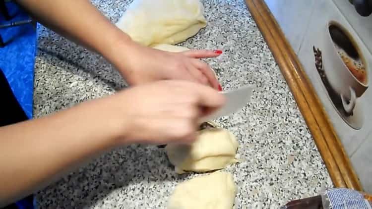 To make raisin rolls, divide the dough