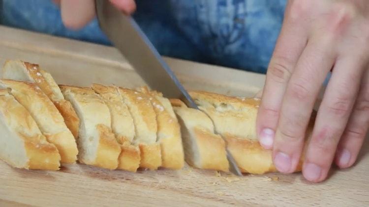 To make a tuna sandwich, cut a baguette